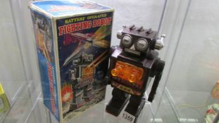 A boxed 'S.H.' Japan battery operated fighting robot.
