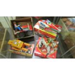 Four boxed tin plate clockwork toys including Robot, Knight, Rocket racer and bulldozer.