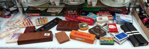 A large lot of vintage playing cards & games include cribbage & dominoes etc.