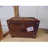 A Victorian rosewood tea caddy inlaid with mother of pearl (missing escutcheon and one side ring.).