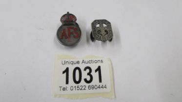 A silver AFS badge and another silver badge.