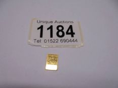 A 1 gram fine gold bar.