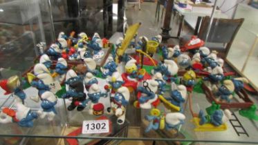 A large collection of 1970's Smurfs including Super Smurfs.