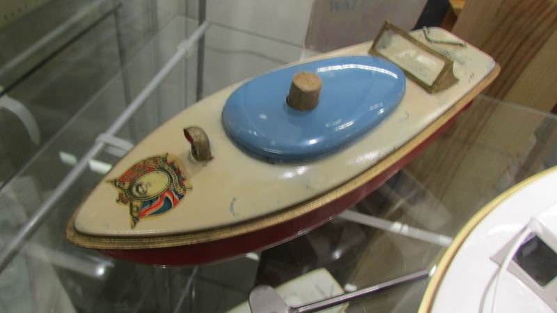 A Sutcliffe Jupiter police launch and a 1953 Coronation Racer 1 clockwork tin plate boats. - Image 3 of 3