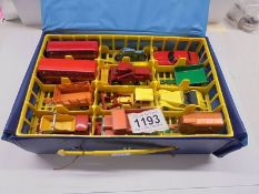 A Matchbox carry case with 24 Matchbox and Corgi Juniors, all in good condition.
