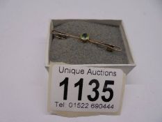 A peridot brooch, circa 1930's in 9ct gold stamped.