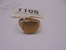 A 9ct gold signet ring, size Q half, 4.4 grams.