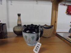 A Doulton Lambeth vase, small plant pot and small teapot.