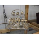 A good quality silver plate egg cup stand with six egg cups and spoons.