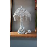 A glass & metal decorative table lamp