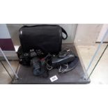 A Pentax P30 camera with bag and a Riva Zoom 90C camera