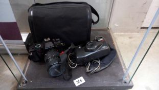 A Pentax P30 camera with bag and a Riva Zoom 90C camera