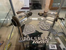 2 vintage AA and a Wolseley 18/85 car badges and 2 brass oilers