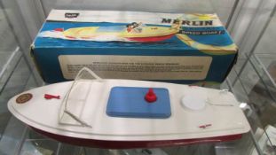 A boxed tin plate Sutcliffe Merlin electric speed boat.
