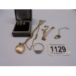 A 9ct gold locket on chain, 2 9ct gold rings, chains etc., 11.5 grams.