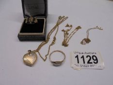 A 9ct gold locket on chain, 2 9ct gold rings, chains etc., 11.5 grams.