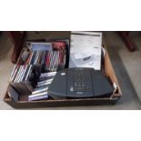 A Bose wave radio/cd with remote (remote in office) and quantity of cd's, cassettes etc