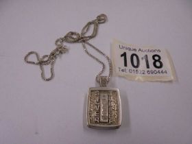 A silver jubilee pendant on silver chain, 20.8 grams.