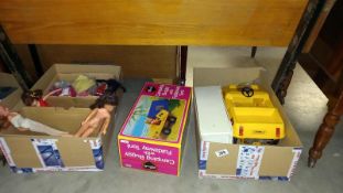 A boxed Sindy buggy with tent, wardrobe and box of clothing and dolls