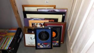 A collection of Elvis Presley drawings, prints, clocks, montages & framed & glazed records etc.