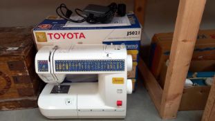 A boxed Toyota JS021 sewing machine. COLLECT ONLY