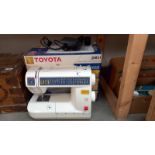 A boxed Toyota JS021 sewing machine. COLLECT ONLY