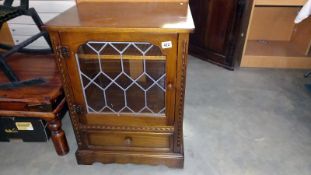 A dark oak display cabinet with leaded glass door, COLLECT ONLY
