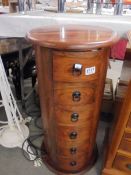 A six drawer circular chest. COLLECT ONLY.