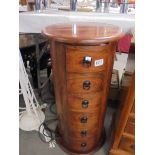 A six drawer circular chest. COLLECT ONLY.