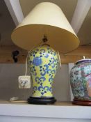 An oriental ceramic table lamp with shade. COLLECT ONLY.