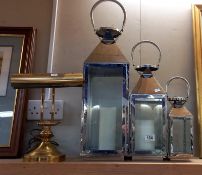 A set of 3 graduated candle lanterns & a brass bankers lamp. COLLECT ONLY