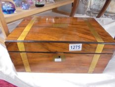 A Victorian mahogany writing box complete with inkwells and spring compartment with two drawers.