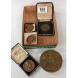A quantity of medallions etc. Including D. H. Lawrence RAF cap badge etc.
