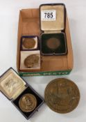 A quantity of medallions etc. Including D. H. Lawrence RAF cap badge etc.
