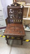 A 19th century oak carved hall chair, COLLECT ONLY