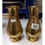 A pair of Victorian heavy brass vases