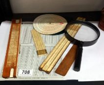 A quantity of vintage slide rules etc. Including magnifying glass