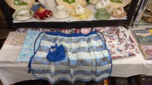 A quantity of vintage aprons