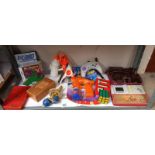 A quantity of vintage games including Larami water pistol, Klee ware doll's house furniture etc.
