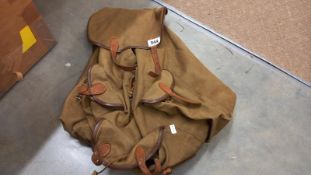 An old scout like ruck sack on metal frame with leather fittings