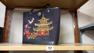 A vintage bag with jewelled Chinese pagoda decoration