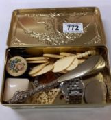 A tin of assorted jewellery etc.