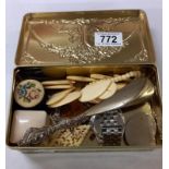 A tin of assorted jewellery etc.