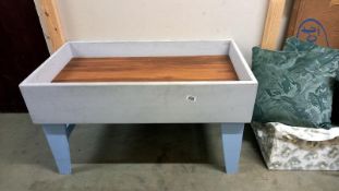 A raised bed for flower pots or a sand pit