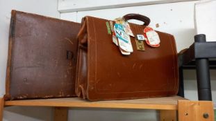 A leather briefcase & a suitcase