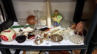 A shelf of miscellaneous candles & candle holders etc.