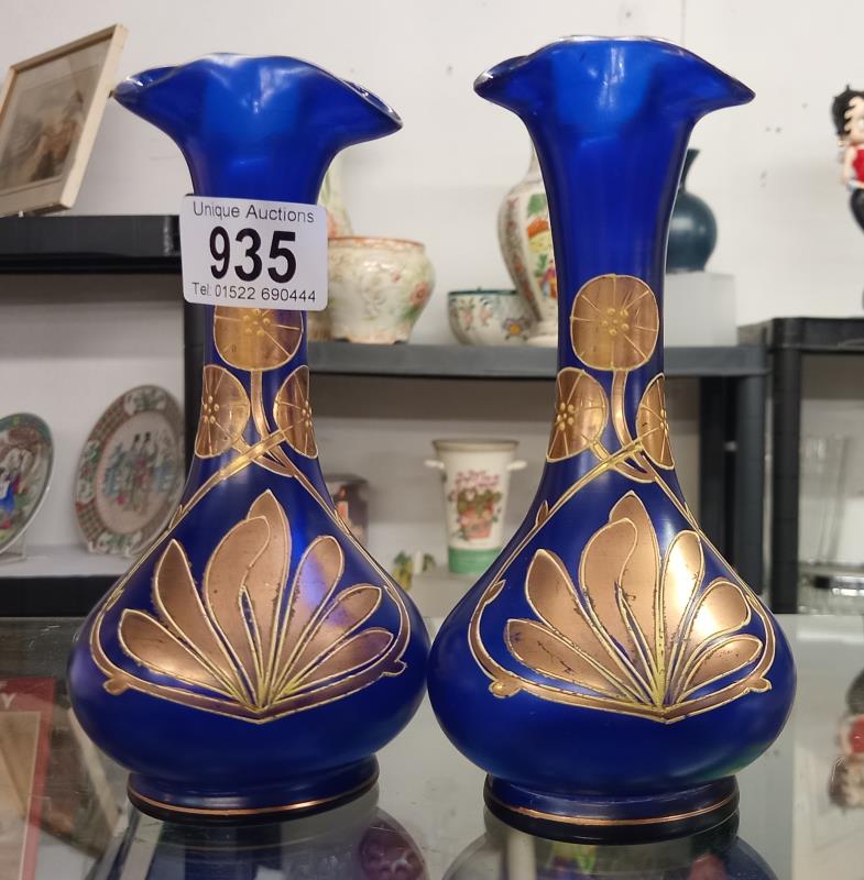 A pair of Victorian blue glass vases with gilded overlay