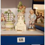 A Continental bisque porcelain figural spill vases & Harold Hunt Buxton, St Annes Spring crested
