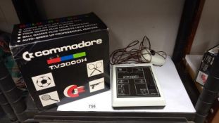 A vintage boxed Commodore T.V. 3000H TV game