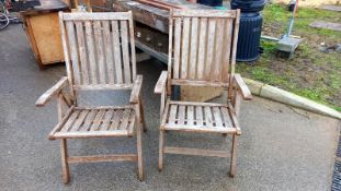 A pair of folding teak garden chairs, COLLECT ONLY